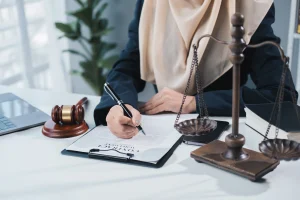 A legal professional reviewing regulatory documents, representing how takaful insurance law and compliance frameworks are shaping the GCC insurance sector.